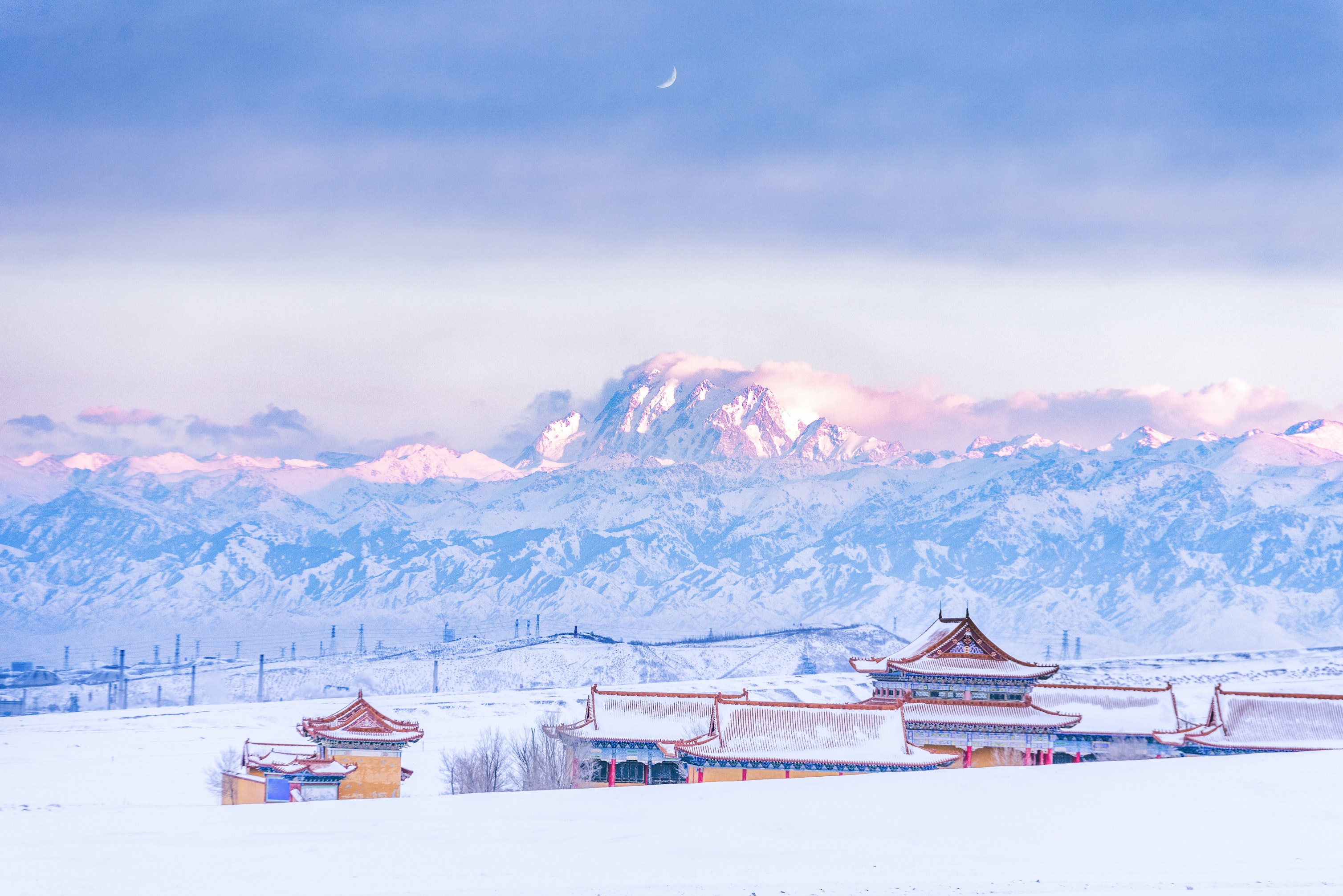 Xinjiang snowy landscape behind a building