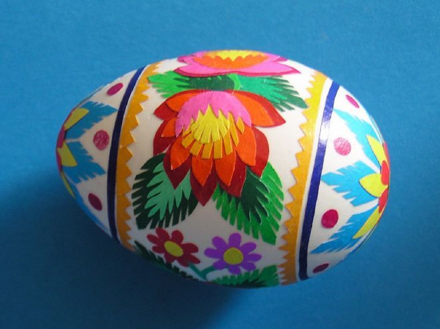 Polish Naklejanka egg with floral pattern made of cut and pasted multi-colored paper